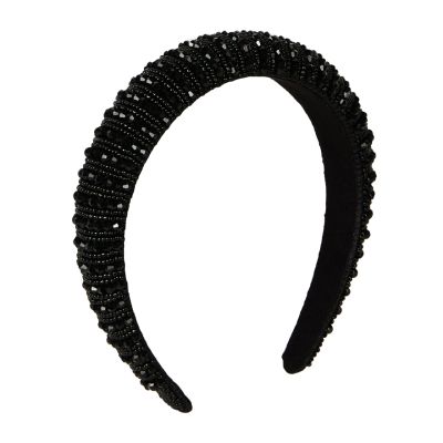 A black velvet headband embellished with black beads in two different shapes, tiny round beads and angular, diamond-cut beads. 