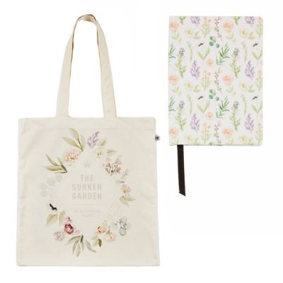 A cotton tote bag with a floral print in a diamond shape with the words, The Sunken Garden at Kensington Palace, alongside a matching floral notebook. 
