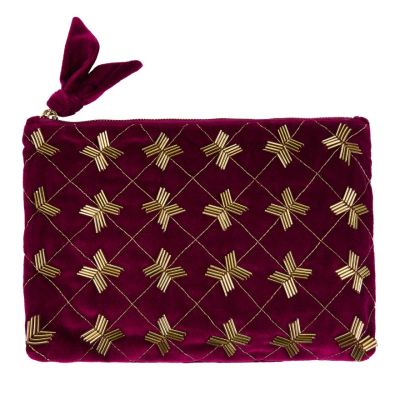 A purple quilted zipped purse with a deco beaded design stitched onto one side. 