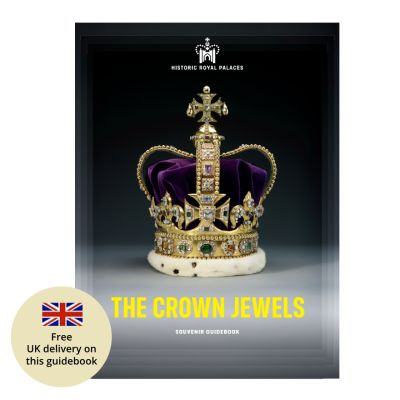 The front cover of a Crown Jewels guidebook with a photo of an ornate gold crown inlaid with gemstones. The title reads, The Crown Jewels. 