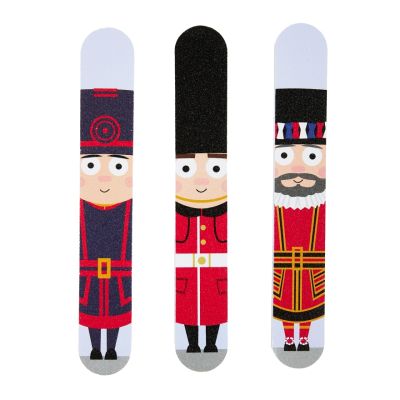 A set of three nail files printed with Tower of London characters including a Beefeaters and a royal guard. 