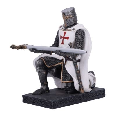 A metallic coloured kneeling knight figurine wearing chainmail and a white surcoat. His outstretched arms work as a pen holder and the pen is shaped like a sword. 