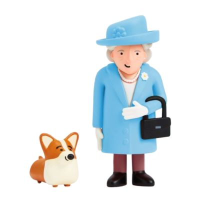 A small Queen Elizabeth II figurine wearing a blue coat and matching hat. She is carrying a small black handbag on her left arm and has a white necklace on. The set includes a smiling corgi dog in brown and cream. 