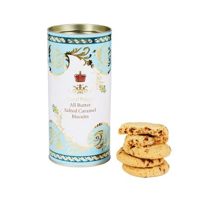 Gold and blue biscuit tin with biscuits on the side
