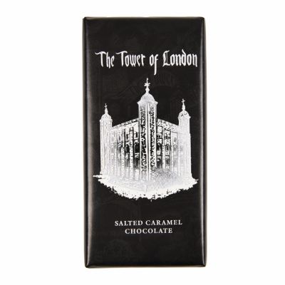A chocolate bar in a black wrapper with an illustration of the White Tower at the Tower of London in silver foil. 