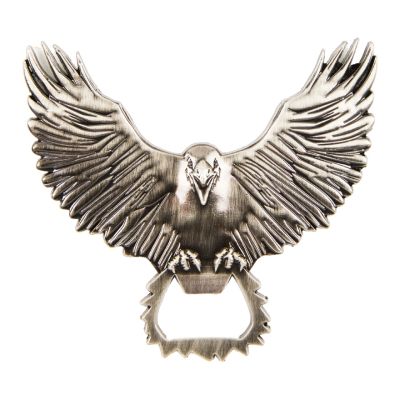 a metal bottle opener in the shape of a raven with its wings spread open and its claws clutching the bottle opener section.