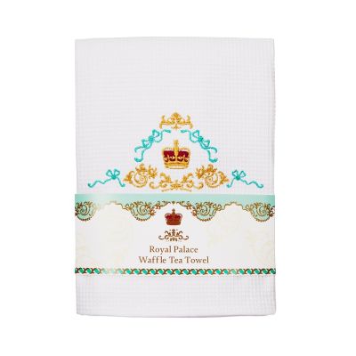 White tea towel folded with gold and blue crown detailing