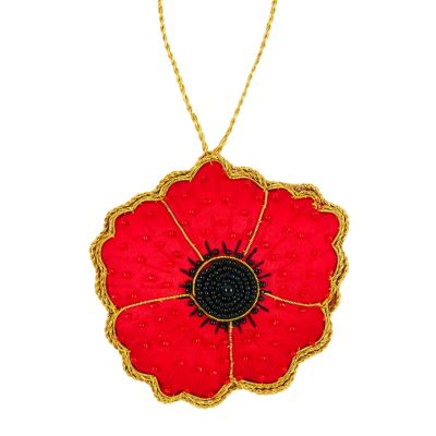 A red poppy hanging decoration with a black beaded centre. Finished with gold stitching details. 