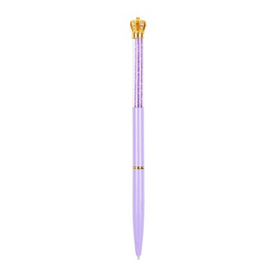 A light-purple pen with a gold crown topper embellished with white crystals. 