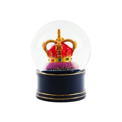Snow globe with gold crown