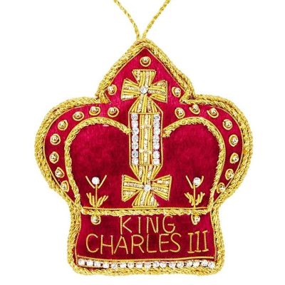 A red velvet crown trimmed with gold cord and diamantes. 'King Charles III' text sewn at the bottom of crown