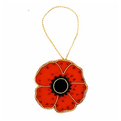 A red, plush velvet hanging decoration in the shape of a poppy, finished with glass beads and gold thread. 
