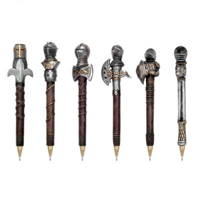 A set of medieval knight resin novelty pens in silver, gold and brown with various helmet designs. 