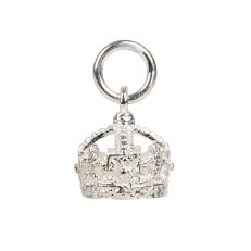 A silver bracelet charm in the shape of Queen Victoria's crown hanging from a small silver bracelet loop.