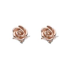 A pair of silver stud earrings plated in rose gold in the shape of a rose.