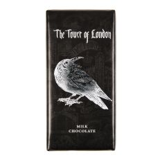 A chocolate bar packaged in a black and silver foil wrapper with an illustration of a raven and the White Tower in the background. 