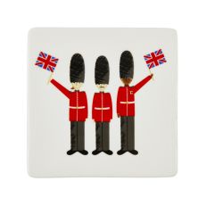 White coaster with three British guards waving the Union Jack flag