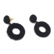 A pair of black beaded earrings with stud tops and drop circular hoops. 