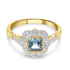 Blue topaz gold ring set in diamond setting