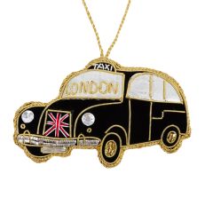 A black London taxi hanging decoration finished with gold thread and beads. The windscreen reds, London and the front features an embroidered Union Jack. 