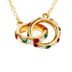 Two intertwined gold ring with blue, red and clear jewels on a chain