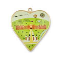 A heart shaped decoration trimmed with gold and an illustration of Hampton Court Palace and gardens in the centre