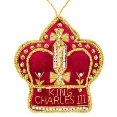 A red velvet crown trimmed with gold cord and diamantes. 'King Charles III' text sewn at the bottom of crown