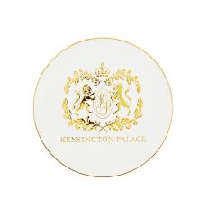 White round coaster with gold edge and crest of Kensington Palace