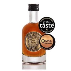 Gold caramel vodka liqueur in glass bottle and black wax seal