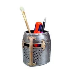 A silver and copper coloured pen pot in the shape of a medieval Crusader helmet.