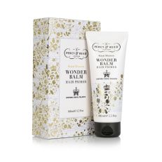White and gold floral packaging with tube of hair primer