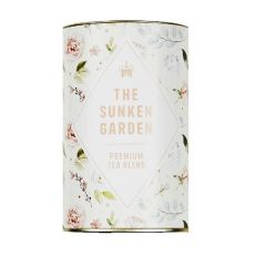 A circular tin of "The Sunken Garden, Premium blend tea" with a watercolour pattern of flowers and leaves on it. 