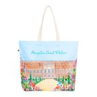 A shopping tote bag printed with a colourful illustration of Hampton Court Palace in the background with the gardens filled with flowers in the foreground. 