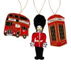Three mini London icons hanging decorations including a red telephone box, a Royal Guard, and a double-decker London bus with Tower of London embroidered on it. All are finished with gold stitching.