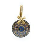 A blue, black and gold astronomical clock hanging decoration with the signs of the Zodiac and a gold ribbon. 