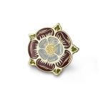 An enamelled metal pin badge in the shape of a Tudor rose in a deep red with green details. 
