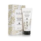 White and gold floral packaging with tube of hair primer