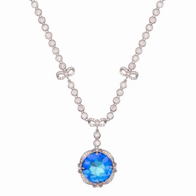 Rhodium plated bow and blue crystal drop necklace