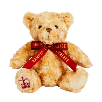 Hampton Court Palace Bear 20cm - A light brown bear wearing a burgundy ribbon with 'Hampton Court Palace' written in gold.  A burgundy crown is embroidered on one foot.