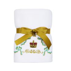 White hand towel with crown wrapped in gold ribbon