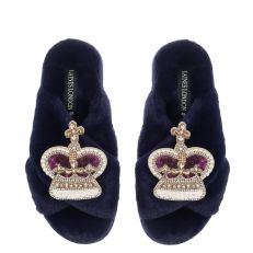 Crown & Corgi Slippers - Navy blue faux fur slippers with a sequin purple & gold crown on one foot and a corgi made up of faux gems on the other. 